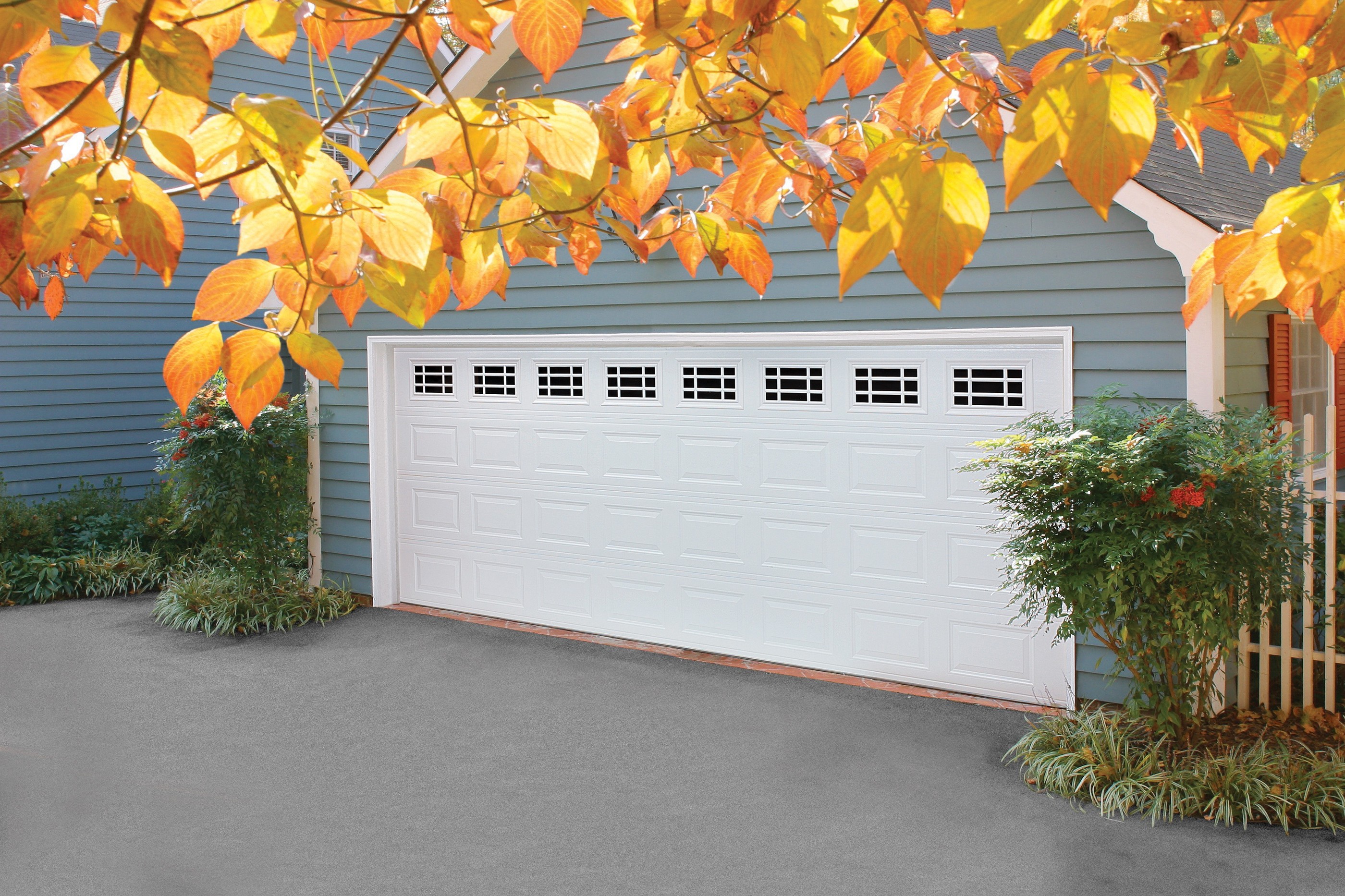 Modern white steel garage door installation